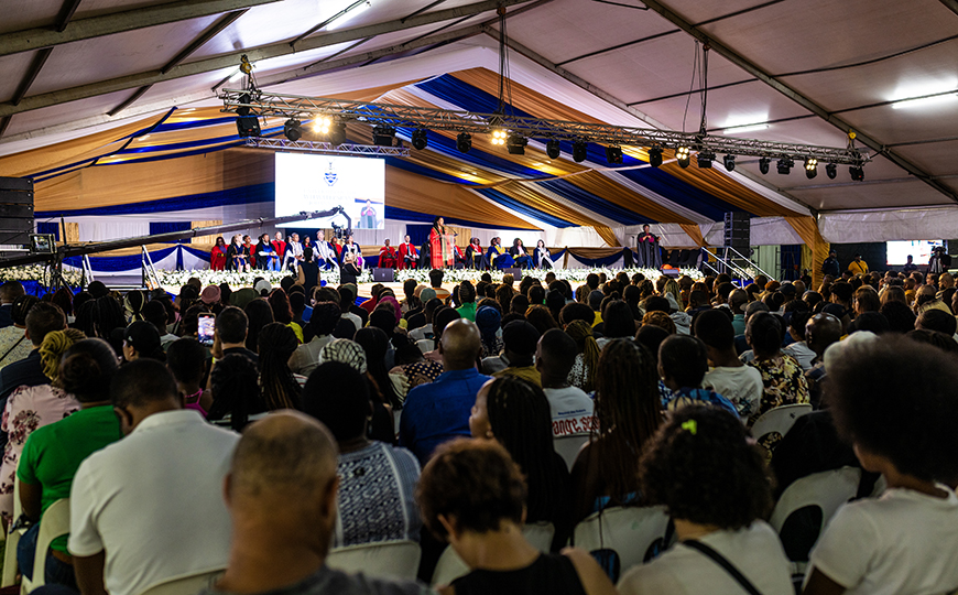 First-year students accompanied by family gathered at the Digs Field for the Welcome Day event.